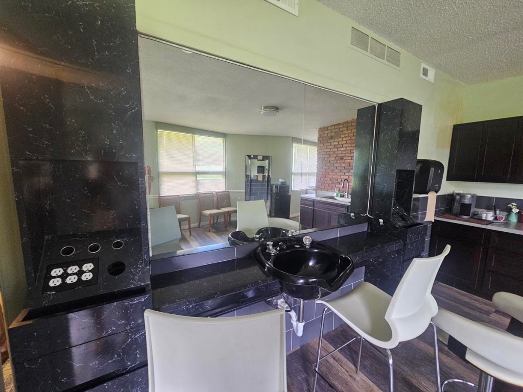 Kitchen area with a bathroom sink and 6 outlets