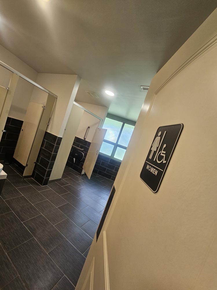 A peek at the women's bathroom with 2 stalls